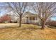Charming home featuring a covered front porch and well-maintained lawn at 6295 Clayton Cir, Frederick, CO 80530