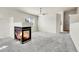 Spacious living area featuring plush carpet, a modern fireplace, and neutral decor at 6295 Clayton Cir, Frederick, CO 80530