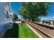 Fenced backyard featuring a green lawn and landscaping, offering a private outdoor space at 12344 Turquoise Terrace St, Castle Pines, CO 80108