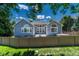 Spacious backyard featuring a fence, lush grass and a patio, perfect for outdoor living at 12344 Turquoise Terrace St, Castle Pines, CO 80108