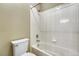 Bathroom featuring a shower-tub combo with white tile and modern fixtures at 12344 Turquoise Terrace St, Castle Pines, CO 80108