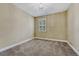 A sunny bedroom with plush carpet, white trim and window, and ample natural light at 12344 Turquoise Terrace St, Castle Pines, CO 80108