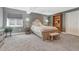 Basement bedroom with a neutral color scheme, comfortable bed, side tables and shelving at 12344 Turquoise Terrace St, Castle Pines, CO 80108