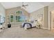 Bright bedroom with vaulted ceilings, large windows, and comfortable decor at 12344 Turquoise Terrace St, Castle Pines, CO 80108