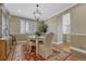 Cozy dining room with elegant chandelier, neutral walls, and a traditional dining set at 12344 Turquoise Terrace St, Castle Pines, CO 80108