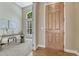 Inviting entryway featuring a wooden front door and an adjacent office space with a large window at 12344 Turquoise Terrace St, Castle Pines, CO 80108