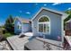 Back exterior of home featuring a patio, fire pit and hot tub at 12344 Turquoise Terrace St, Castle Pines, CO 80108