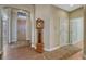 Inviting foyer features hardwood floors, a classic grandfather clock, and a view of the front entrance at 12344 Turquoise Terrace St, Castle Pines, CO 80108