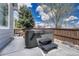 Relaxing hot tub on a private patio with seating and mature landscaping, perfect for unwinding and enjoying the outdoors at 12344 Turquoise Terrace St, Castle Pines, CO 80108