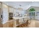 Bright kitchen with large island, stainless steel appliances, and eat-in area at 12344 Turquoise Terrace St, Castle Pines, CO 80108