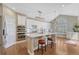 Fully equipped kitchen featuring quartz countertops, stainless steel appliances, and hardwood flooring at 12344 Turquoise Terrace St, Castle Pines, CO 80108