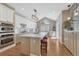 Well-equipped kitchen with a spacious island, modern lighting, and state-of-the-art appliances at 12344 Turquoise Terrace St, Castle Pines, CO 80108