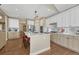 Gourmet kitchen with a large island, stainless steel appliances, and stylish pendant lighting at 12344 Turquoise Terrace St, Castle Pines, CO 80108
