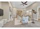 Spacious living room with a fireplace, ample seating, and open archways leading to other areas of the home at 12344 Turquoise Terrace St, Castle Pines, CO 80108