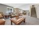 Spacious finished basement with a comfortable living area, stairs, and a separate dining space at 12344 Turquoise Terrace St, Castle Pines, CO 80108