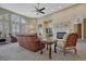 Bright living room featuring a comfortable sofa, decorative accents, and large windows with natural light at 12344 Turquoise Terrace St, Castle Pines, CO 80108