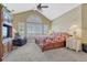 Bright bedroom with vaulted ceilings, large windows, and a comfortable sitting area at 12344 Turquoise Terrace St, Castle Pines, CO 80108
