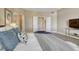 Bright and airy carpeted bedroom with ample natural light from large windows at 12344 Turquoise Terrace St, Castle Pines, CO 80108