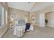 Spacious bedroom featuring a king bed, plush carpet, vaulted ceiling, and bright natural light at 12344 Turquoise Terrace St, Castle Pines, CO 80108