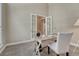 Cozy office with French doors, neutral decor, and a functional desk space with ample natural light at 12344 Turquoise Terrace St, Castle Pines, CO 80108