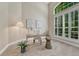 Bright office featuring neutral walls, a large window with shutters, and a stylish desk setup at 12344 Turquoise Terrace St, Castle Pines, CO 80108