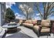 Outdoor patio area with comfortable seating, fire pit, and scenic views, ideal for relaxing and entertaining at 12344 Turquoise Terrace St, Castle Pines, CO 80108