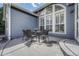 Inviting outdoor patio with table and chairs, perfect for relaxing and entertaining with natural light from large window at 12344 Turquoise Terrace St, Castle Pines, CO 80108