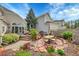 Backyard patio with lounging and dining spaces surrounded by landscaped garden at 1011 S Valentia St # 30, Denver, CO 80247
