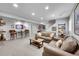 Spacious finished basement featuring a seating area, game table, and shelving at 1011 S Valentia St # 30, Denver, CO 80247