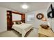 Cozy bedroom with built-in shelving, neutral decor, and natural light at 1011 S Valentia St # 30, Denver, CO 80247