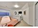 Bedroom featuring a large window, modern decor, and bedside table at 1011 S Valentia St # 30, Denver, CO 80247