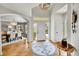 Spacious foyer featuring hardwood floors, modern decor and an archway leading to the dining area at 1011 S Valentia St # 30, Denver, CO 80247