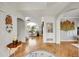 Bright foyer with hardwood floors that lead to the living room, showcasing open floor plan at 1011 S Valentia St # 30, Denver, CO 80247