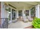 Relaxing front porch featuring comfortable seating and decor, perfect for enjoying the outdoors at 1011 S Valentia St # 30, Denver, CO 80247