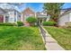 Inviting two-story home with a landscaped front yard and concrete steps leading to the entryway at 1011 S Valentia St # 30, Denver, CO 80247