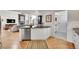 View of kitchen and open concept living area with stainless steel appliances at 1011 S Valentia St # 30, Denver, CO 80247