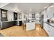 Spacious kitchen with an island, stainless steel appliances, and sleek white cabinetry at 1011 S Valentia St # 30, Denver, CO 80247