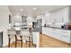 Bright kitchen with a center island, stainless steel appliances, and bar stool seating at 1011 S Valentia St # 30, Denver, CO 80247