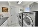 Well-equipped laundry room with modern washer and dryer, plus stylish decor and ample counter space for folding at 1011 S Valentia St # 30, Denver, CO 80247