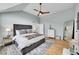 Comfortable main bedroom with a ceiling fan, hardwood floors, a dresser, and a full-length mirror at 1011 S Valentia St # 30, Denver, CO 80247