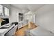 Stylish home office with hardwood floors, built-in shelving, large windows with shutters, and neutral decor at 1011 S Valentia St # 30, Denver, CO 80247