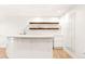 Modern bar area with custom shelving, sleek countertops, and great lighting at 5745 S Andes St, Aurora, CO 80015