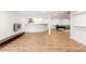 Spacious finished basement featuring modern flooring, a bar, and a cozy lounge area at 5745 S Andes St, Aurora, CO 80015