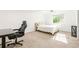 Bright bedroom featuring a queen-size bed, and large window at 5745 S Andes St, Aurora, CO 80015