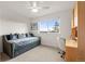 Bedroom with a daybed, workspace, and a view from the window at 5745 S Andes St, Aurora, CO 80015
