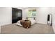 Bright bedroom featuring a queen-size bed, large window, and spacious closet at 5745 S Andes St, Aurora, CO 80015