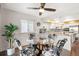 Cozy dining area with seating for four, opening onto an outdoor patio and kitchen at 5745 S Andes St, Aurora, CO 80015