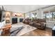 Comfortable living room with reclining seating, fireplace and large windows at 5745 S Andes St, Aurora, CO 80015