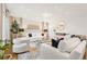 Bright living room with white decor, recessed lighting, and a modern fireplace at 5745 S Andes St, Aurora, CO 80015