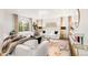 Bright living room with white decor, recessed lighting, and a modern fireplace at 5745 S Andes St, Aurora, CO 80015